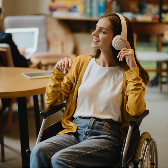 Female listening to music with her headphones on in a wheelchair