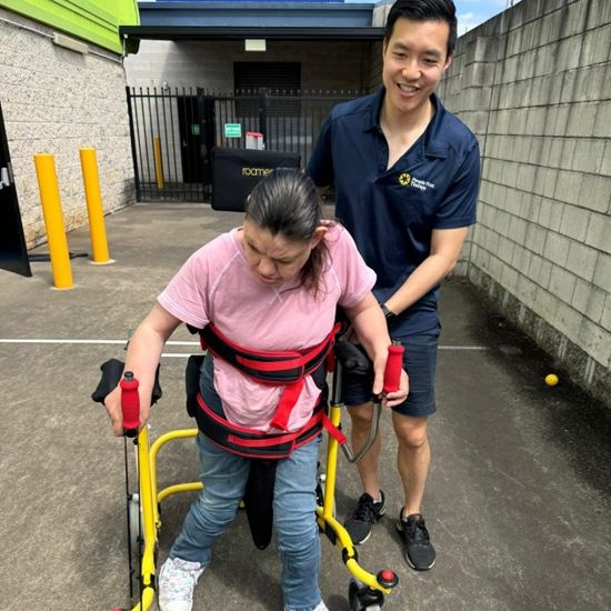 Chris Assisting Patient With Frame SQUARE